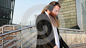 Man with beard listening to music