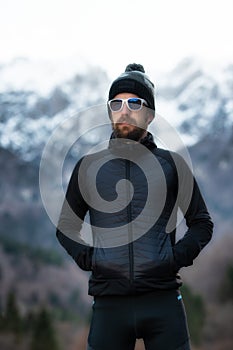 Man with beard mountaineer portrait only the mountains