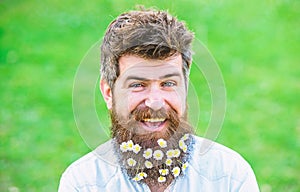 Man with beard and mustache enjoy spring, green meadow background. Masculinity concept. Hipster on happy smiling face