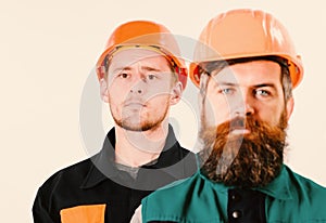 Man with beard and mustache in hard hat, helmet isolated white background. Builder near colleague. Builder, engineer