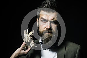 Man with beard and mustache wears bow tie