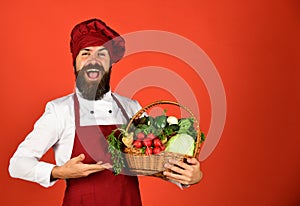 Man with beard on red background. Cook with excited face