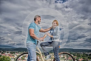 Man with beard and shy blonde lady on first date. How to meet girls while riding bike. Picking up girl. Couple just meet