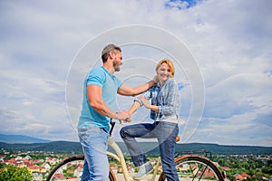 Man with beard and shy blonde lady on first date. How to meet girls while riding bike. Picking up girl. Couple just meet