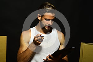 Man with beard stands on black background. Seduction and moving