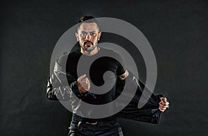 Man with beard on unshaven face. Bearded man undress leather jacket. Fashion model in casual style clothes. Style and photo