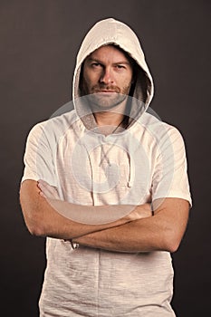 Man with beard wear hood. Bearded man in casual sweatshirt. Fashion model in hoodie tshirt. Active lifestyle and health