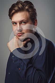 Man with beard wearing bow tie in studio