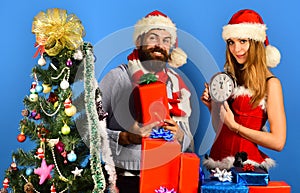 Man with beard and woman with happy faces on blue