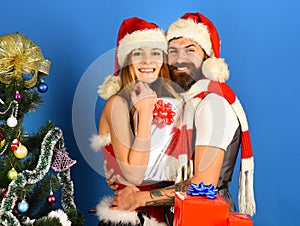 Man with beard and woman with happy faces on blue