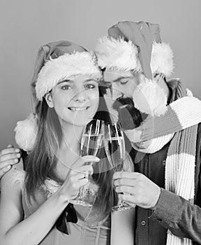 Man with beard and woman with smiling faces on red