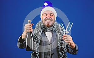 Man bearded cheerful hipster santa hold champagne and glasses. Christmas party organisers. Boss tinsel ready celebrate