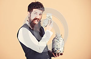 Man bearded guy hold jar full of cash savings. Safe place to keep money. Personal accountant. Businessman with his