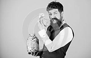 Man bearded guy hold jar full of cash savings. Safe place to keep money. Personal accountant. Businessman with his