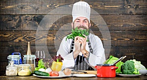 Man bearded hipster cooking fresh vegetables. Culinary recipe concept. Freshest possible ingredients. Chef use fresh