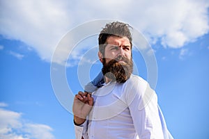 Man bearded hipster formal style look back sky background. Frustration feeling. Guy reached top but feel frustrated