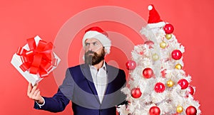 Man bearded hipster formal suit happy celebrate christmas. Gift service concept. Send or receive christmas present. Gift