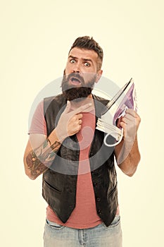 Man bearded hipster hold electric ironing tool. How iron clothes correctly. Guy with iron on white background isolated