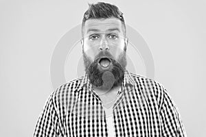 Man bearded hipster with sneezing face open eyes close up yellow background. Brutal hipster sneezing. Allergy concept