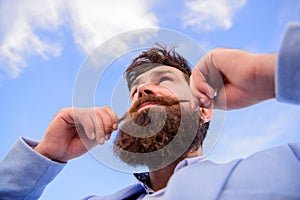 Man bearded hipster twisting mustache sky background. Ultimate moustache grooming guide. Hipster handsome attractive guy