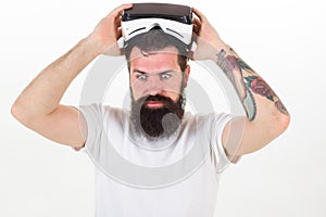 Man bearded hipster with virtual reality headset on white background isolated. Sensational feelings of using VR headset