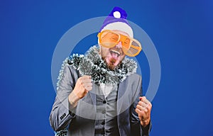 Man bearded hipster wear santa hat and funny sunglasses. Christmas party organisers. Guy tinsel ready celebrate new year