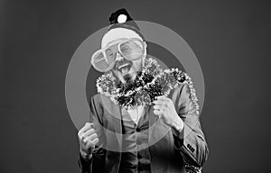 Man bearded hipster wear santa hat and funny sunglasses. Christmas party organisers. Guy tinsel ready celebrate new year