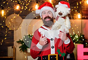 Man bearded Santa claus play with soft toy teddy bear. Christmas charity. Kindness and generosity. Charity help. Spread