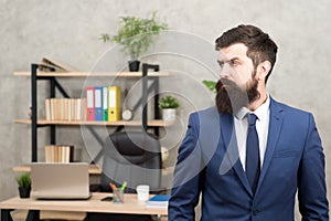 Man bearded serious office background. Provide consultation to management on strategic staffing plans. Office staff. HR