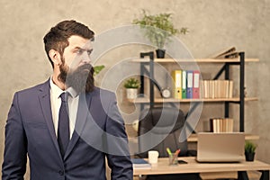 Man bearded serious office background. Provide consultation to management on strategic staffing plans. Office staff. HR