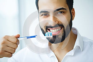 Man With Beautiful Smile, Healthy White Teeth With Toothbrush. H