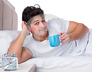 Man in bed suffering from insomnia