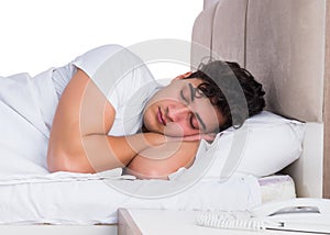 Man in bed suffering from insomnia