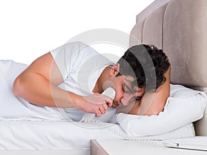 Man in bed suffering from insomnia