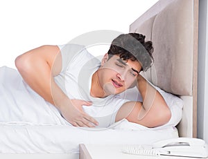 Man in bed suffering from insomnia