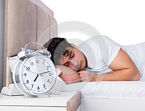 Man in bed suffering from insomnia