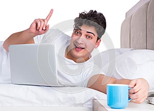 Man in bed suffering from insomnia