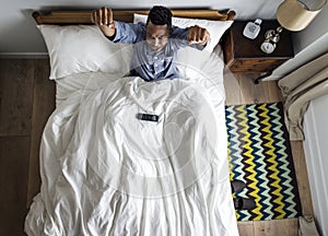 Man in bed watching a TV