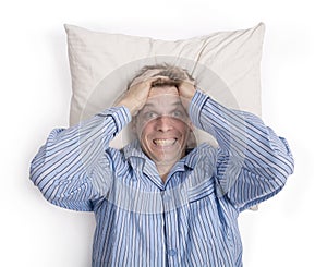 Man in bed worried or stressed