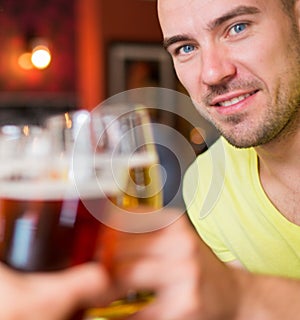 Man with beer in a pub