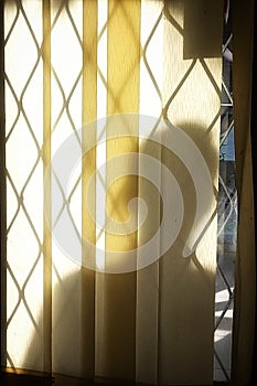 Man behind the light in fornt off window wall orange pastel color obstacle