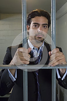 Man Behind Prison Bars