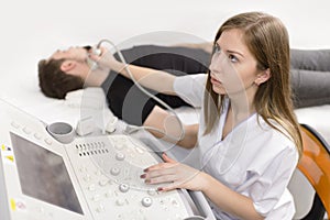 Man Being Checked for Thyroid at Ultrasound Device