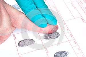 Man being finger printed photo