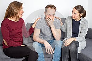 Man being sad in living room photo