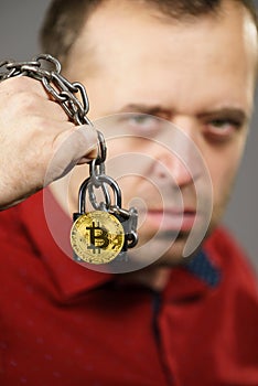 Man being tied up in block chain