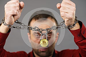 Man being tied up in block chain