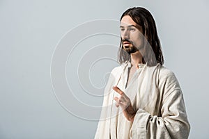 Man with belief gesturing isolated on grey