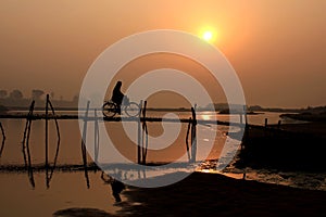 Man on bicycle.