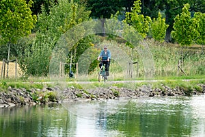 Man on bicycle, Gota Canal, Sweden photo